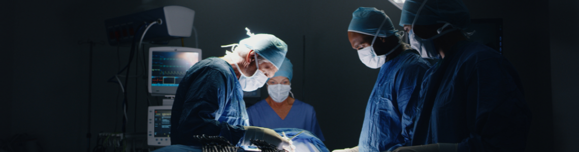 surgeons in an operating room performing surgery