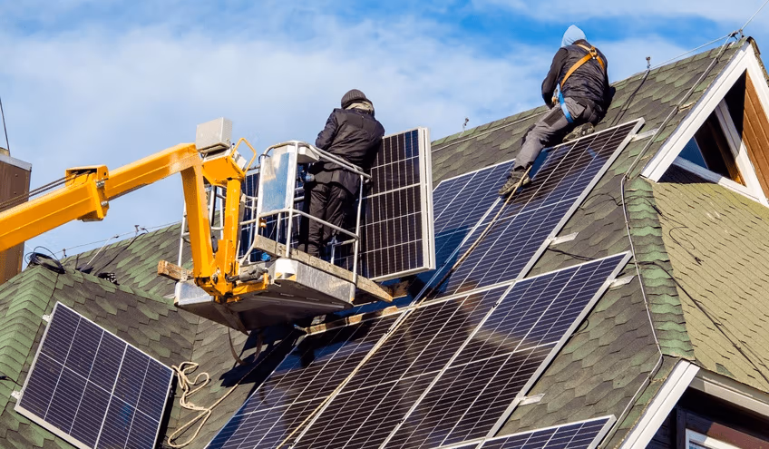 Solar panels installation in progress on roof