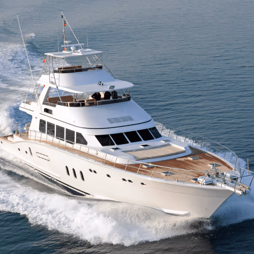 White yacht cruising in through sea waters