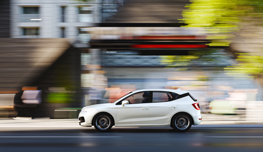 White car passing on the road