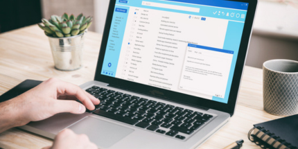 Person working on templates on laptop