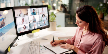 Trainee attending training session and taking notes