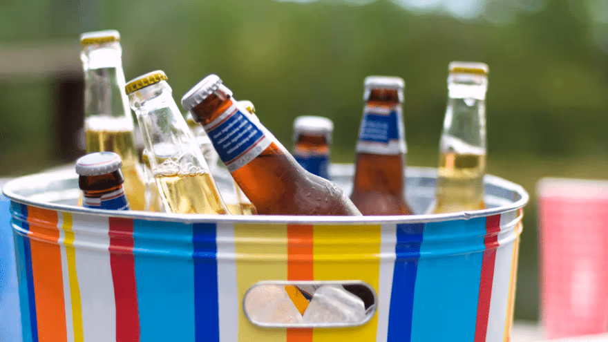Beer beverage bottles in colorful ice bucket