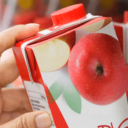 Apple juice box being taken off the shelf