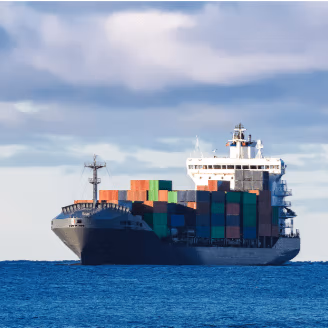 Cargo ship in middle of blue sea