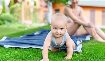 Baby crawling away from its mother. 