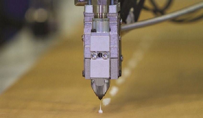 Hot melt being applied to a box.