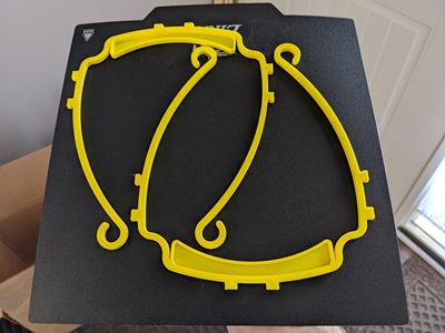 Pieces for a facemask made with a 3D printer.