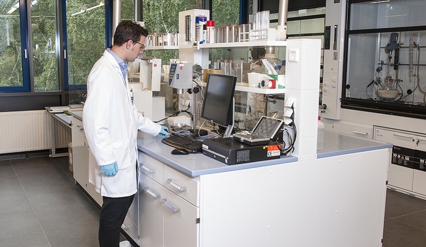 H.B. Fuller lab worker in white jacket