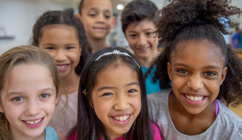 A diverse group of children smiling