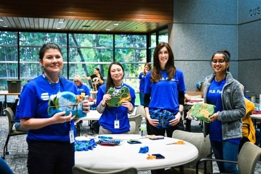 H.B. Fuller employees assembling kits for The Bond Between