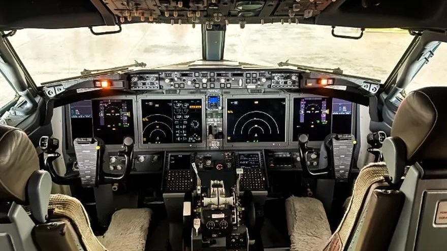 Inside the cockpit view of flight controls and instrument clusters