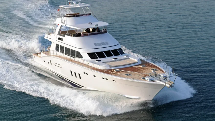 White yacht cruising in through sea waters