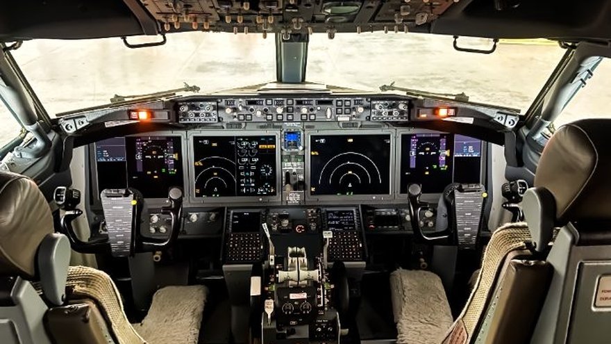 Inside the cockpit view of flight controls and instrument clusters