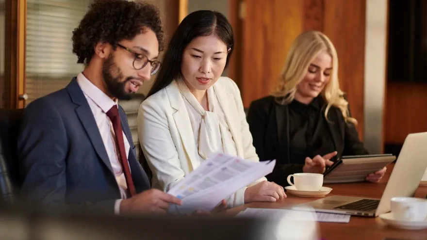 Colleagues discussing the business document