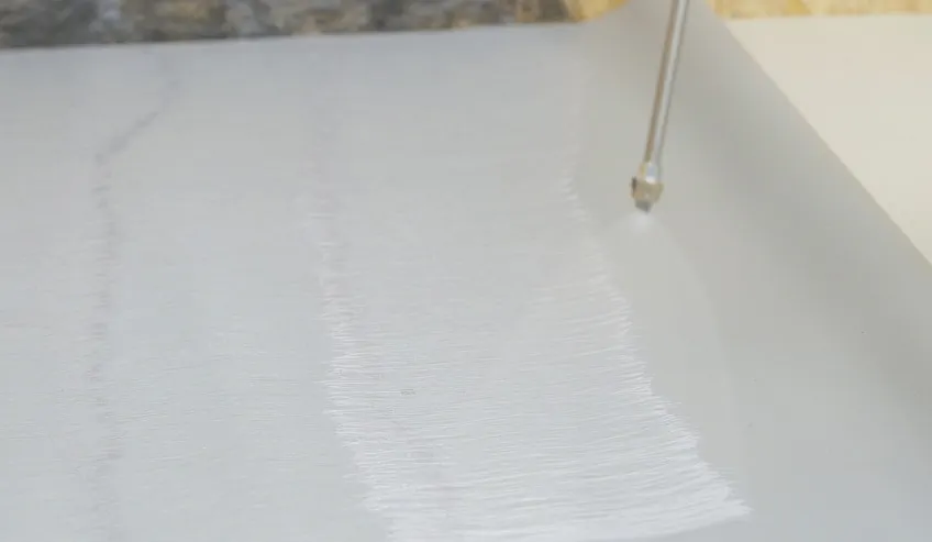 Adhesives being sprayed on surface