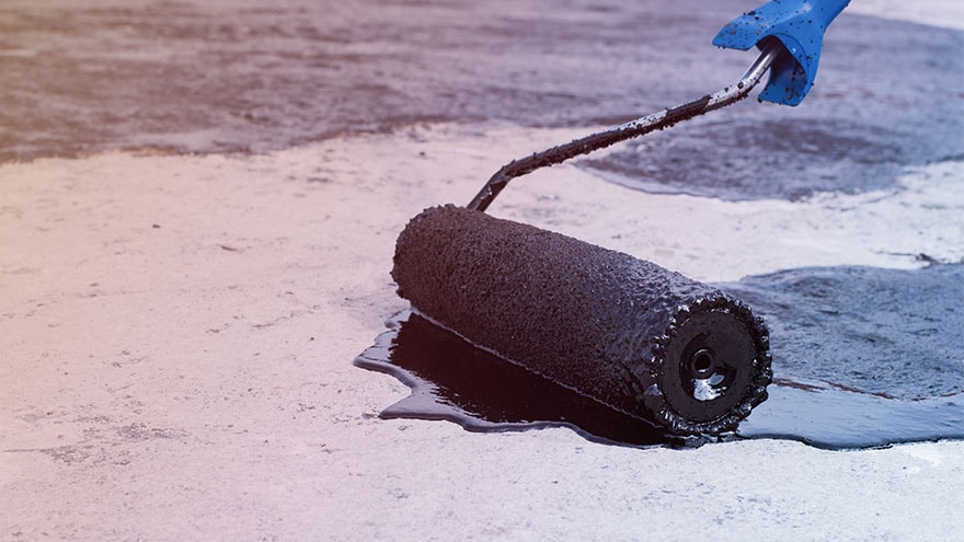 Bitumen applied to roof with roller