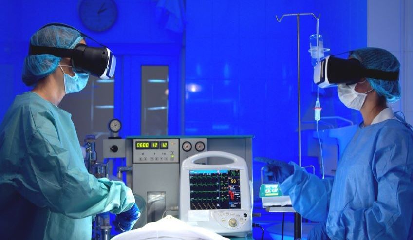 Surgeons wearing virtual realty goggles in operating room