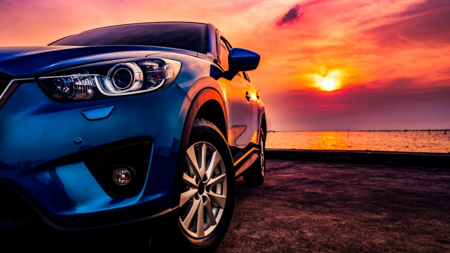 Car left front close up by the sunset